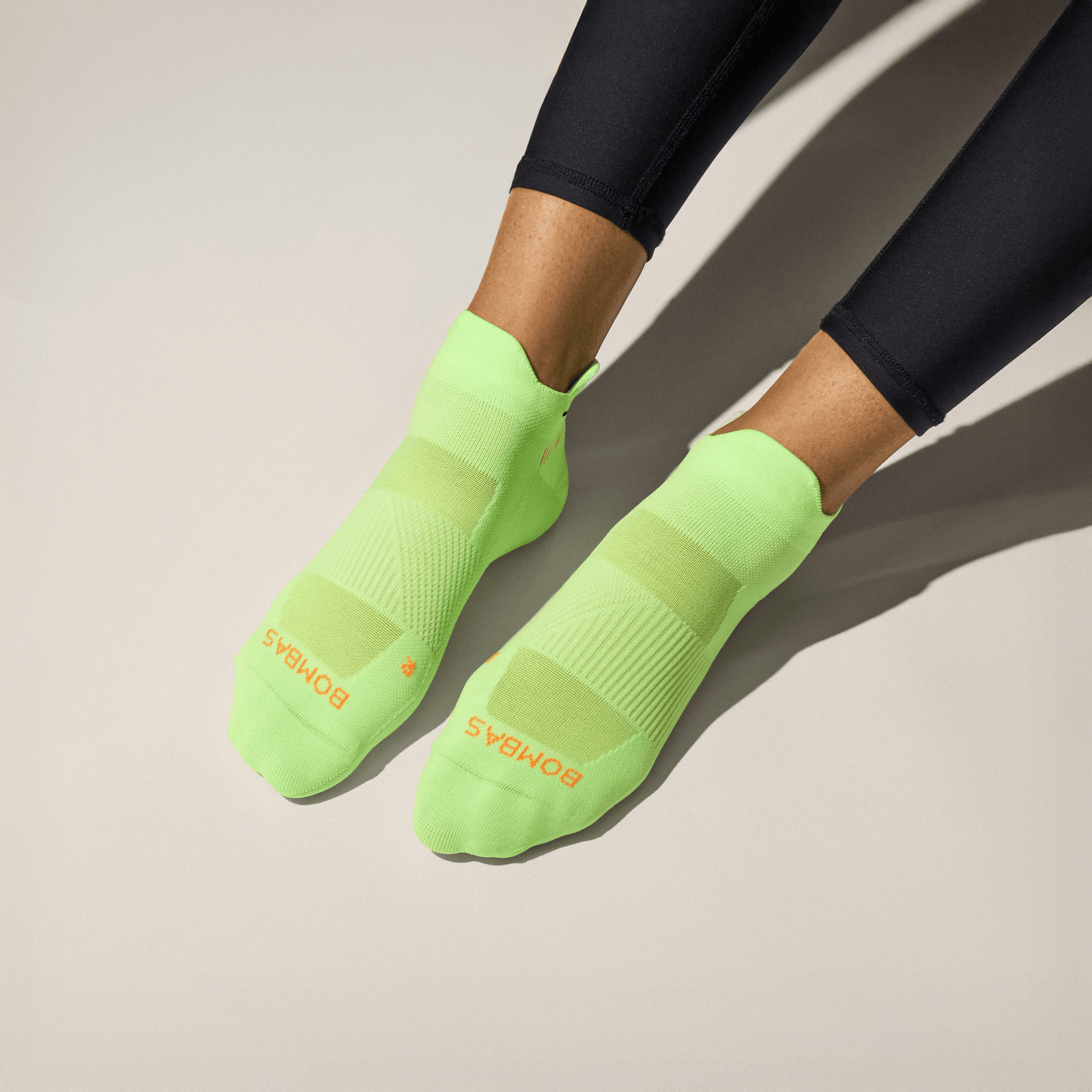 official-bombas::11013-neonlime-adult-unisex-onmodel-0-transparent.png