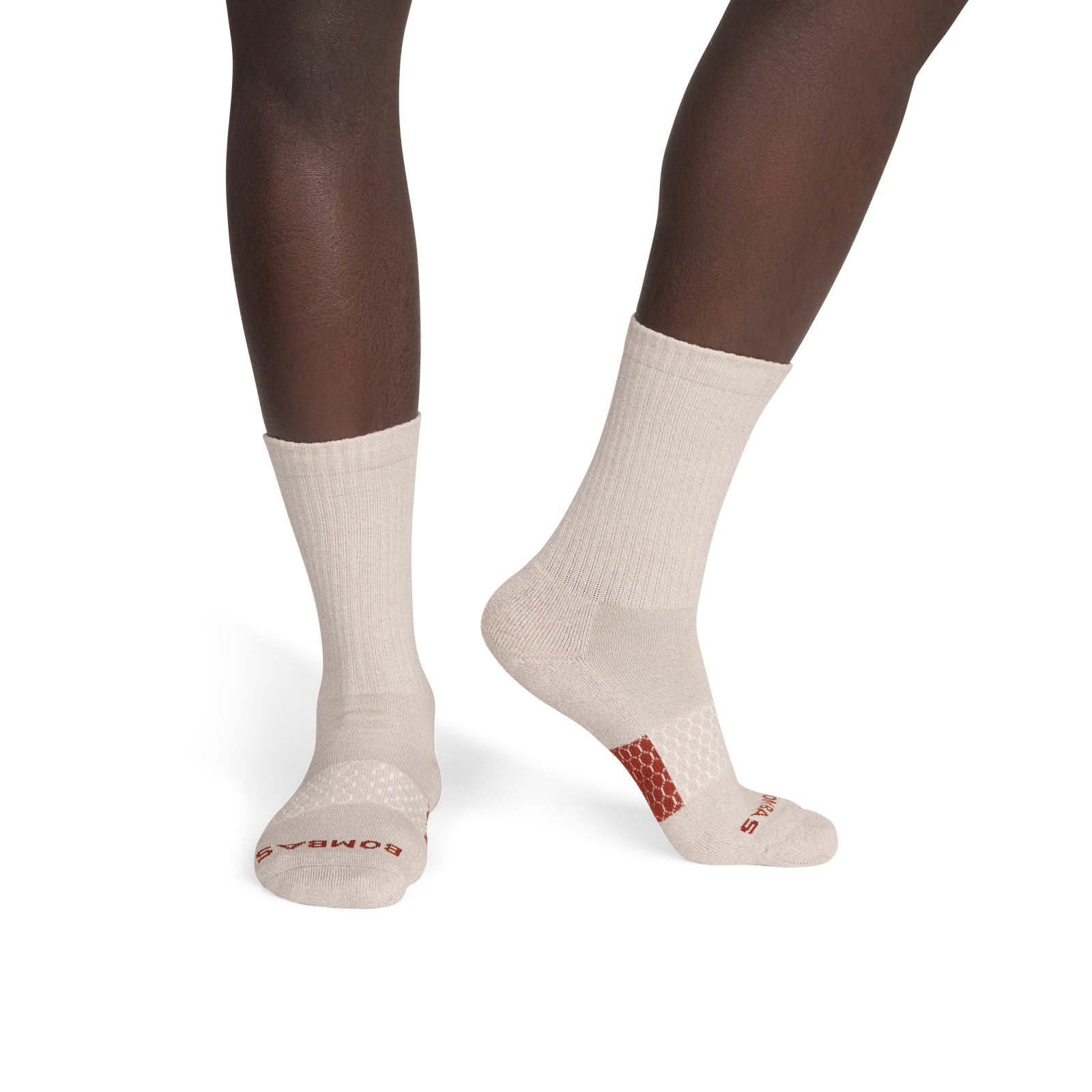 official-bombas::6975-naturaltaupe-rustbrown-adult-male-onmodel-2-transparent.png